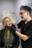 Doctor examining a patient's ear in a medical setting